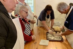Photo of blind travelers learning how to make scones at an old Irish farmhouse