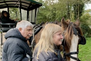 Photo of Elaine and Ed saying hello to a horse in Killarney
